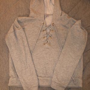 Cropped sweatshirt with criss cross strings